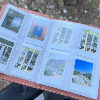 A GIF displaying a wedding album brimming with Polaroid-style photos, highlighting the personalized and unique gift couples receive to relive their special day.