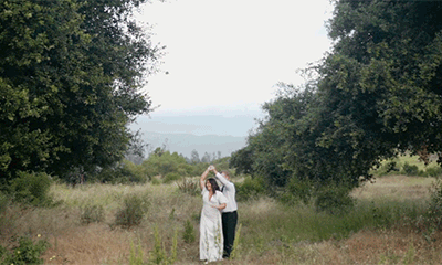 Groom spinning Bride around in San Diego Mountains