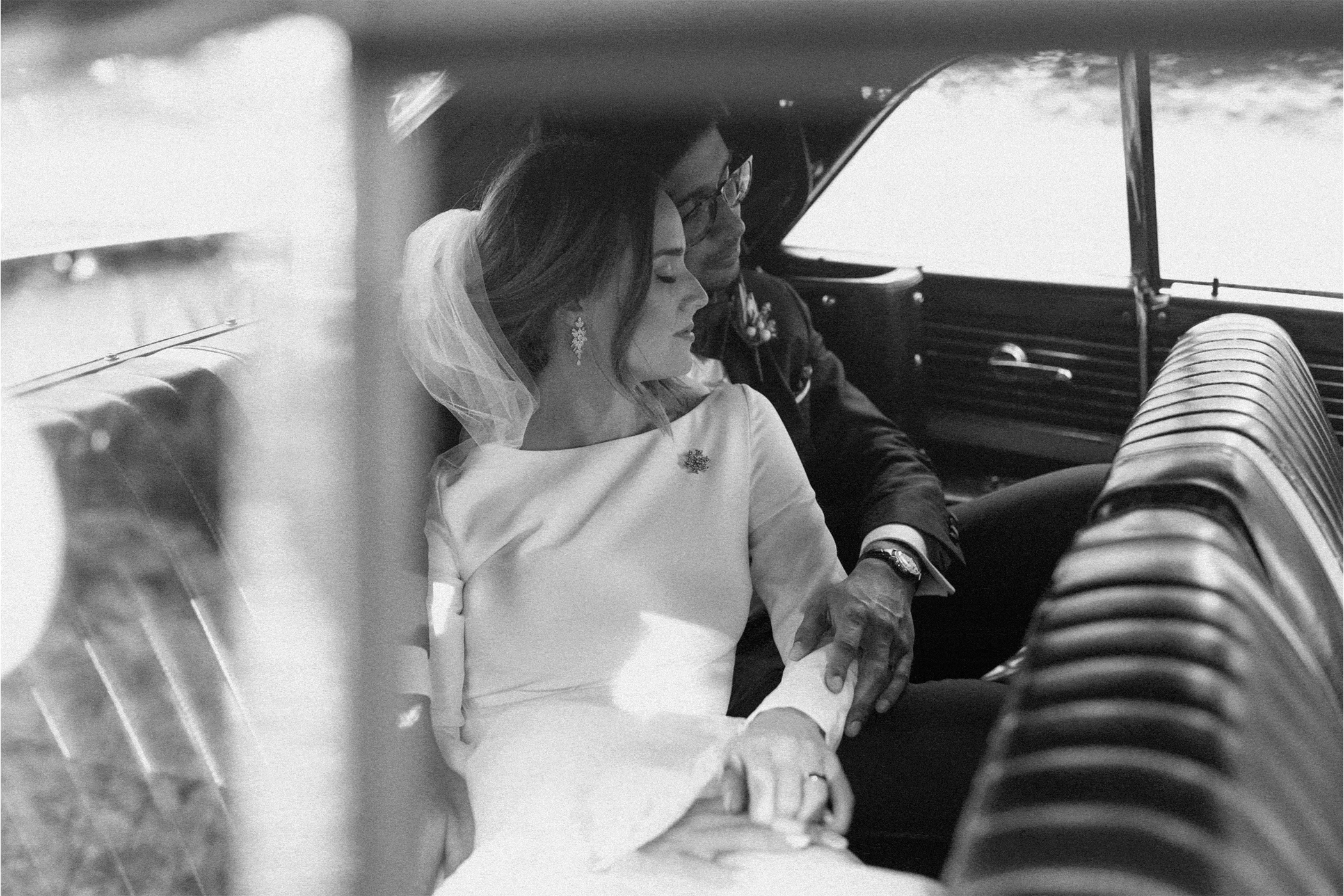 bridal couple in the car