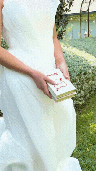 GIF video of a wedding outside and vow books