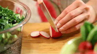 Elizabeth West, a personal trainer in Boca Raton, chopping up vegetables.
