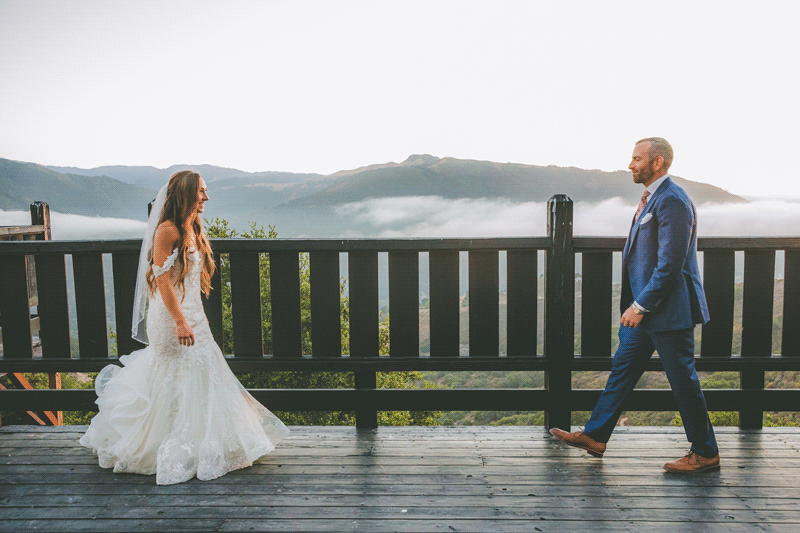A bride and groom walk towards each other and kiss in this gif animation.