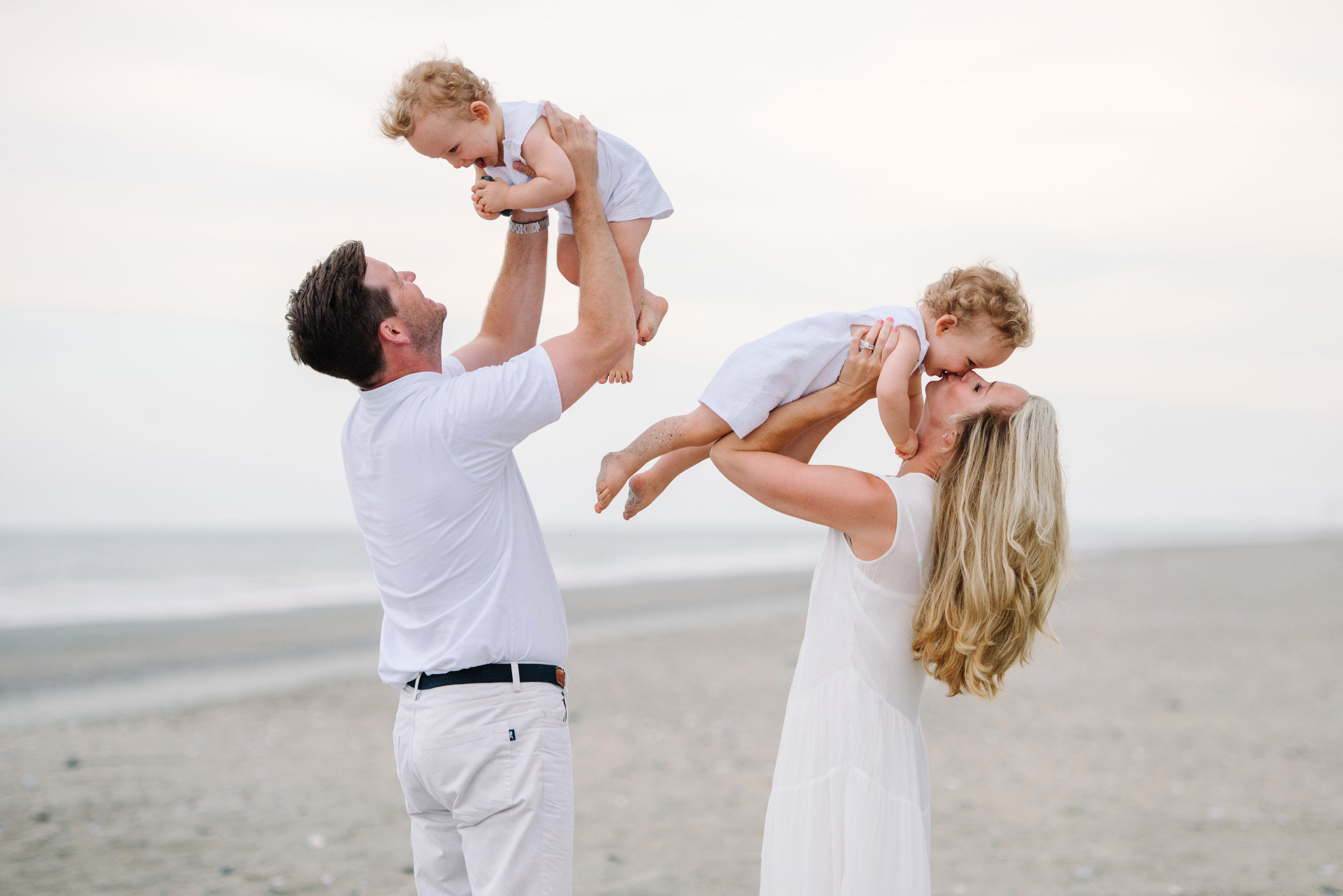 Cute Family Beach Pictures - Myrtle Beach Family Photographer - Mom and Dad playing with Kids
