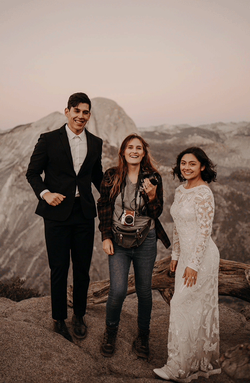 moving GIF of Dana the photographer with a bride and groom celebrating