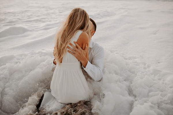 couple kissing in ocean gif
