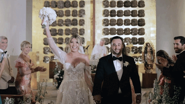 bride and groom walking out of ceremony