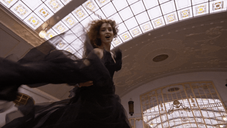 Gif of woman in black ballgown dancing in a beautiful, intricate building to show the vibe of the Showit website to be whimsical, magical, and dynamic.