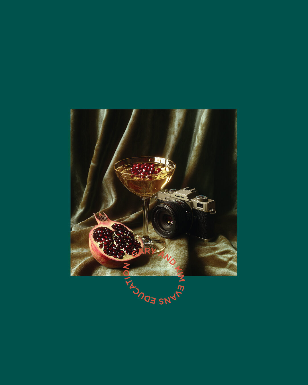 Still life of cocktail, camera, and pomegranate styled on velvet, used to illustrate Gary and Kim’s blend of photography, education, and luxury.