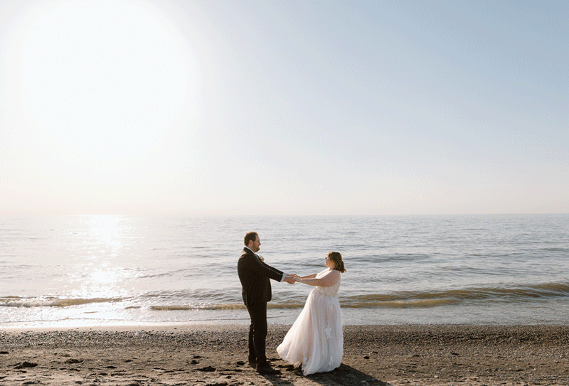 Bride and groom dancing on Lake Erie.