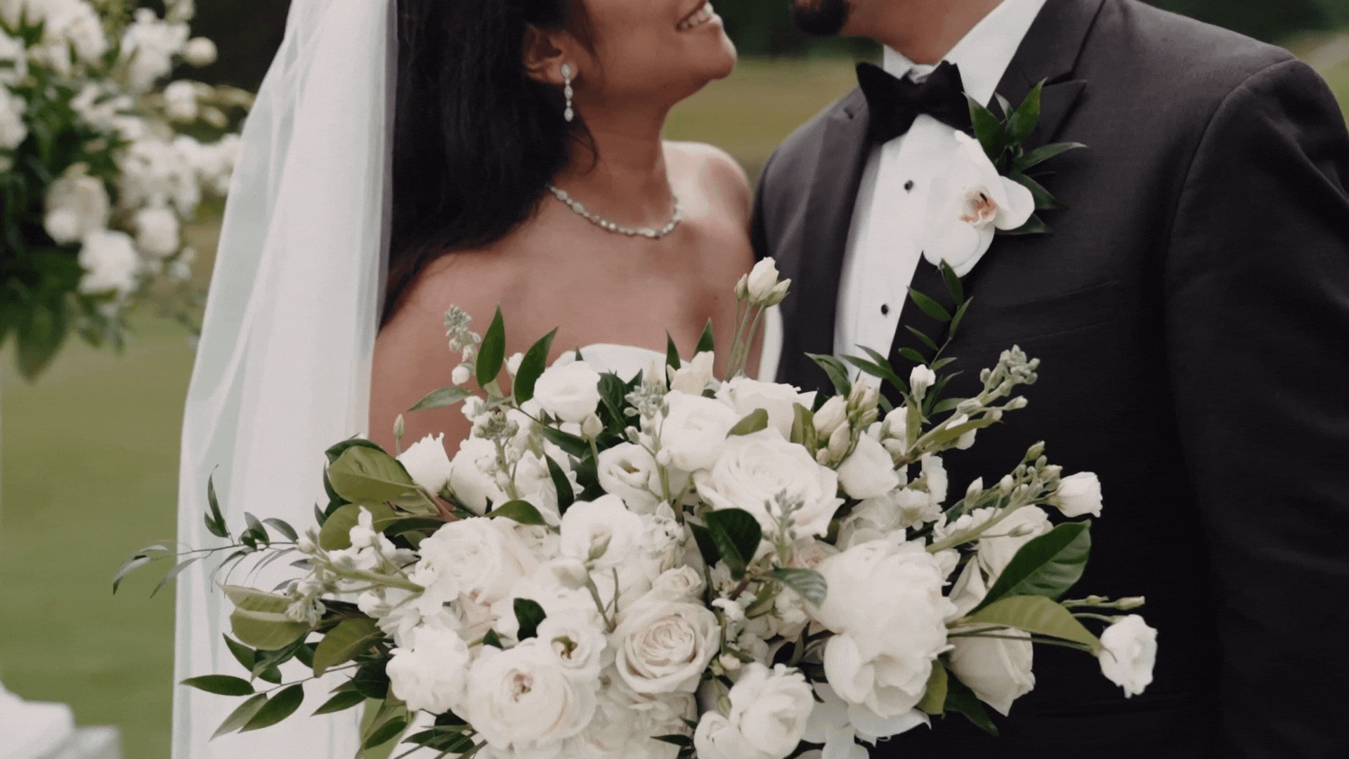 bride and groom on their wedding day romantic portrait light and airy burgundy flowers gray suit