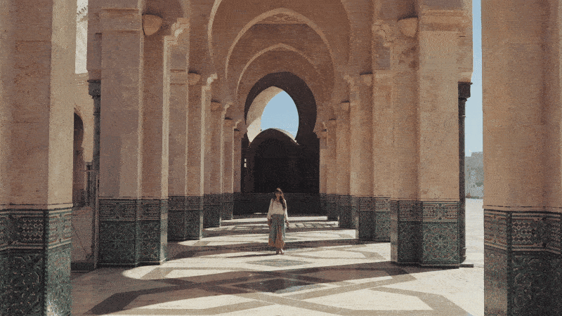 woman walks in beautiful buidling