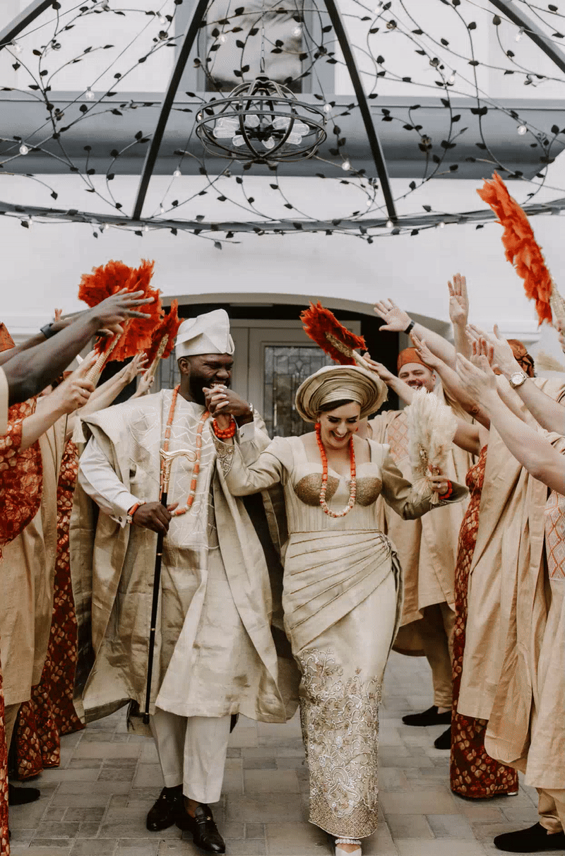 A couple celebrates during their exit on their wedding day.