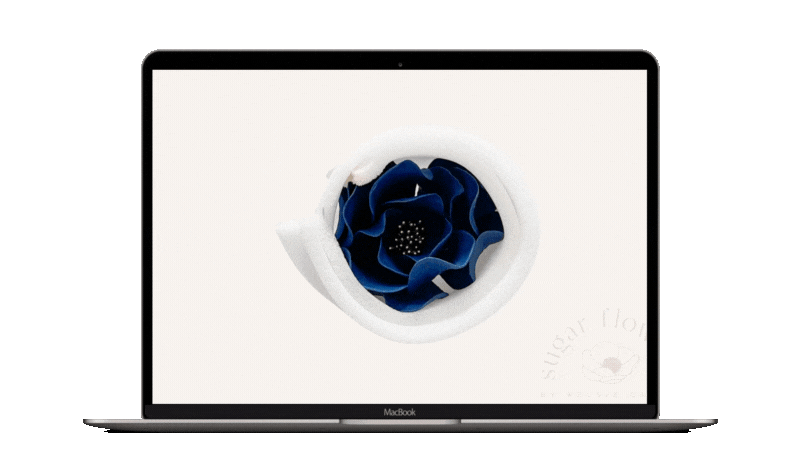 laptop with gif of an open rose sugar flower slowly being unwrapped