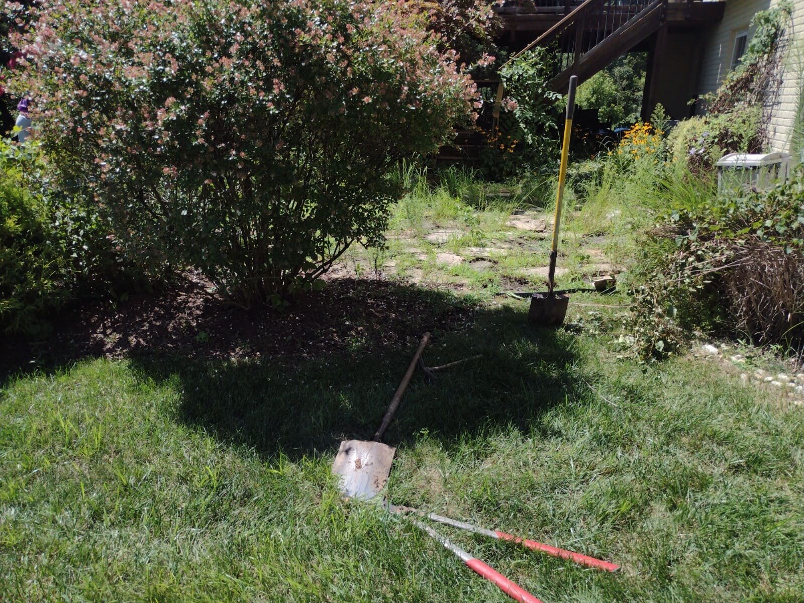 Before backyard paver stone transformation