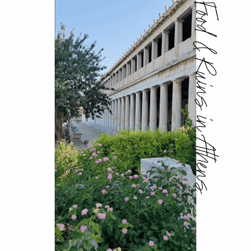 Ancient colonnade of the Stoa of Attalos in Athens, with flowering greenery in the foreground and blue skies above ©Stephanie Dosch | theViatrix Personalized Athens Destination Guide