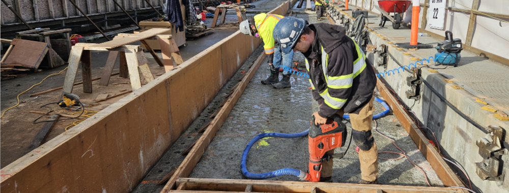 An operator drilling through concrete