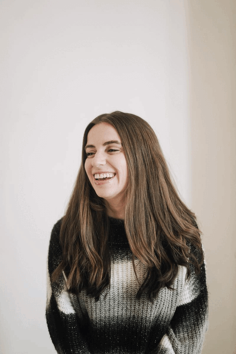 Woman-owned brand agency creative director Amanda Burg smiles in animated GIF in her Knoxville studio