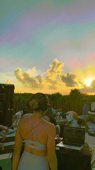 GIF of a retreat group doing a yoga flow in Tulum