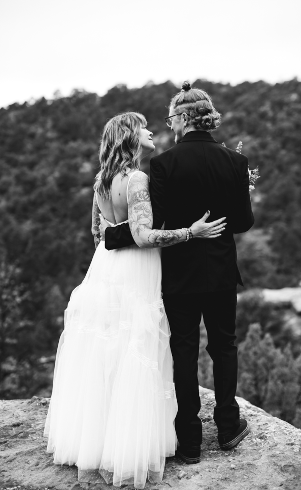 Black and White GIF of Bride grabbing Groom's butt on a mountain in Colorado