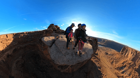 Micaela base jumps off a cliff in Moab, Utah
