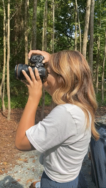 Video of Dakota Hersey photographing a bridal party in front of a white chapel