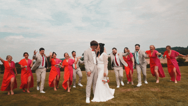 Couple having fun with their wedding party  captured by Oxfordshire untraditional wedding videographer