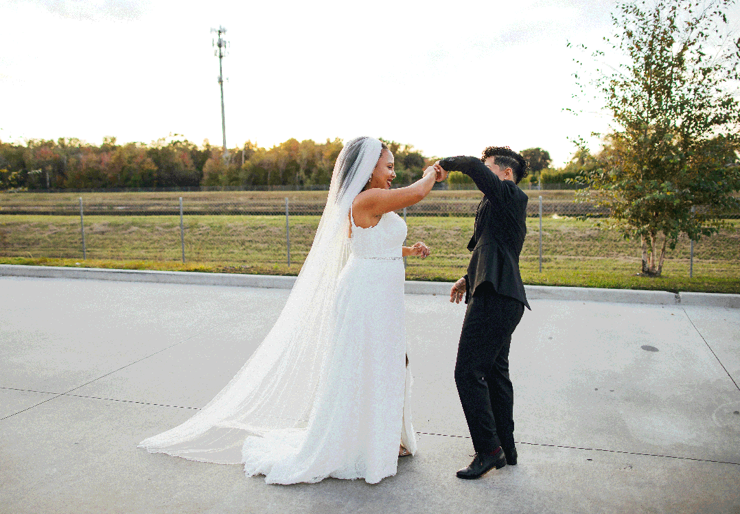 Couple Dancing in Parking Lot on Wedding Day during Golden Hour