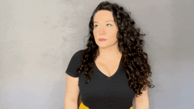 Woman with dark curly hair