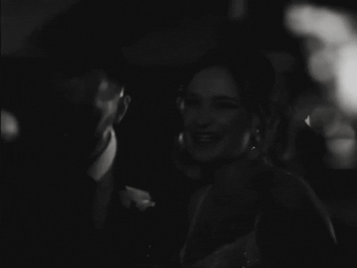 black and white video of couple laughing at their winter wedding 