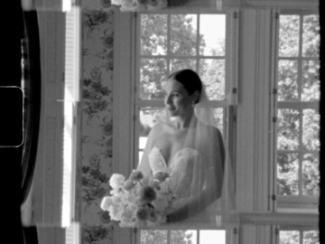 Super 8 film of a bride smiling.