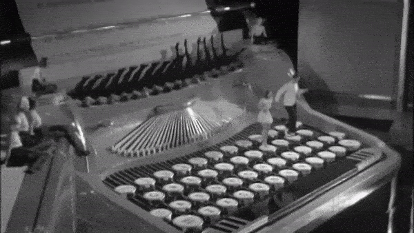 retro video of couple dancing on typewriter