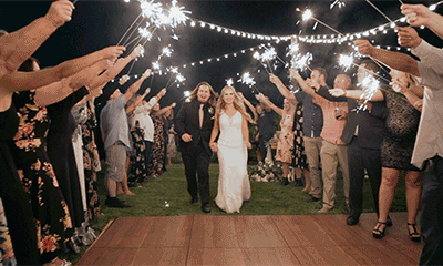 Bride and Groom walking under sparklers for grand exit