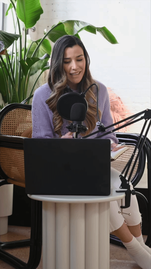 GIF of Women speaking into microphone
