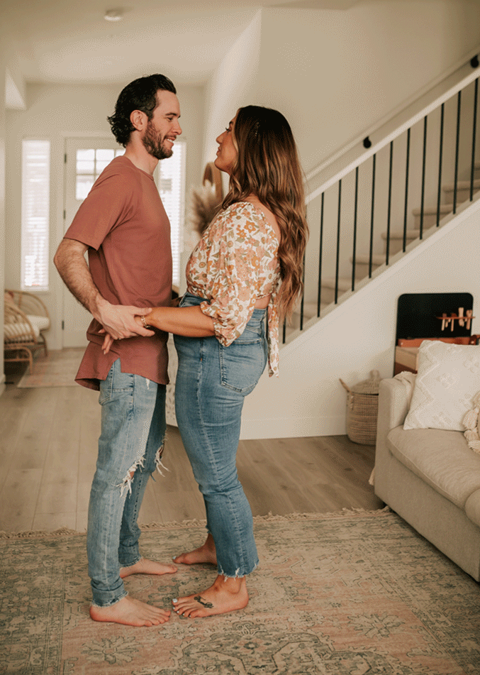 couple dancing in their living room