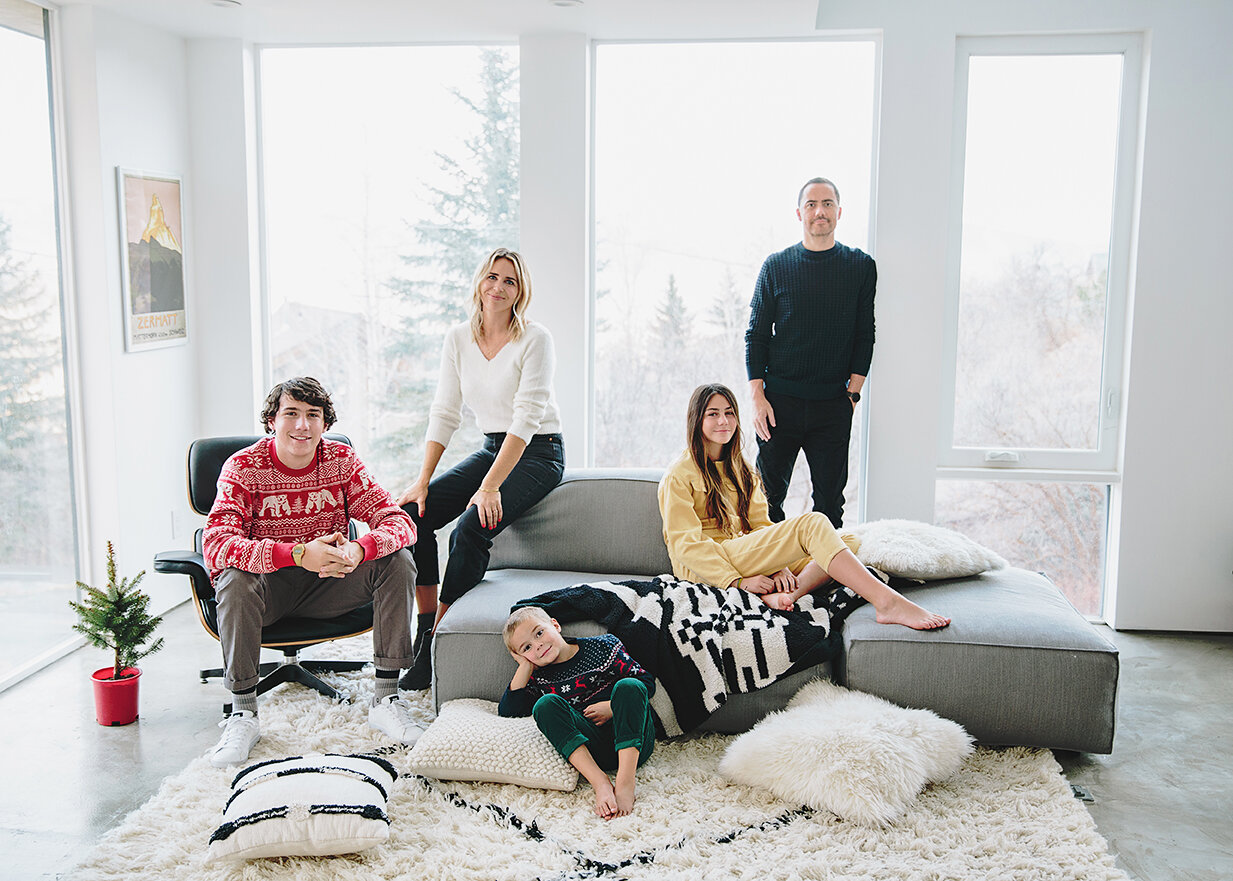 a family of 5 wearing christmas style for their in-home shoot