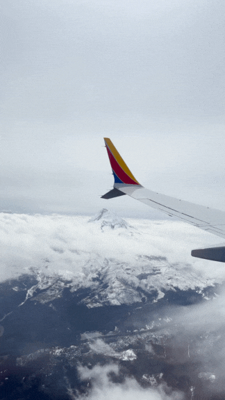 A GIF showing the stunning view outside Danielle Rose Photography’s plane window, capturing the breathtaking landscape as she travels to her next wedding or elopement destination.