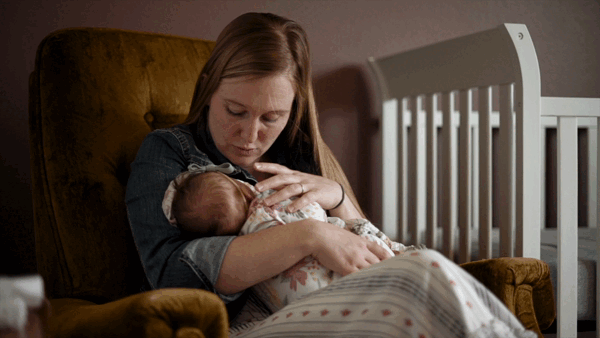 mother holding baby