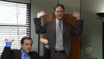 A GIF of Micheal and Dwight from the office TV show arms above head