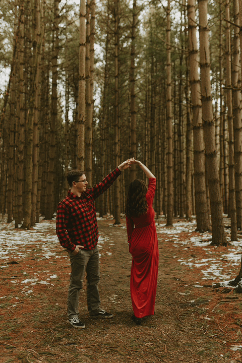 couple dancing on a forest trail