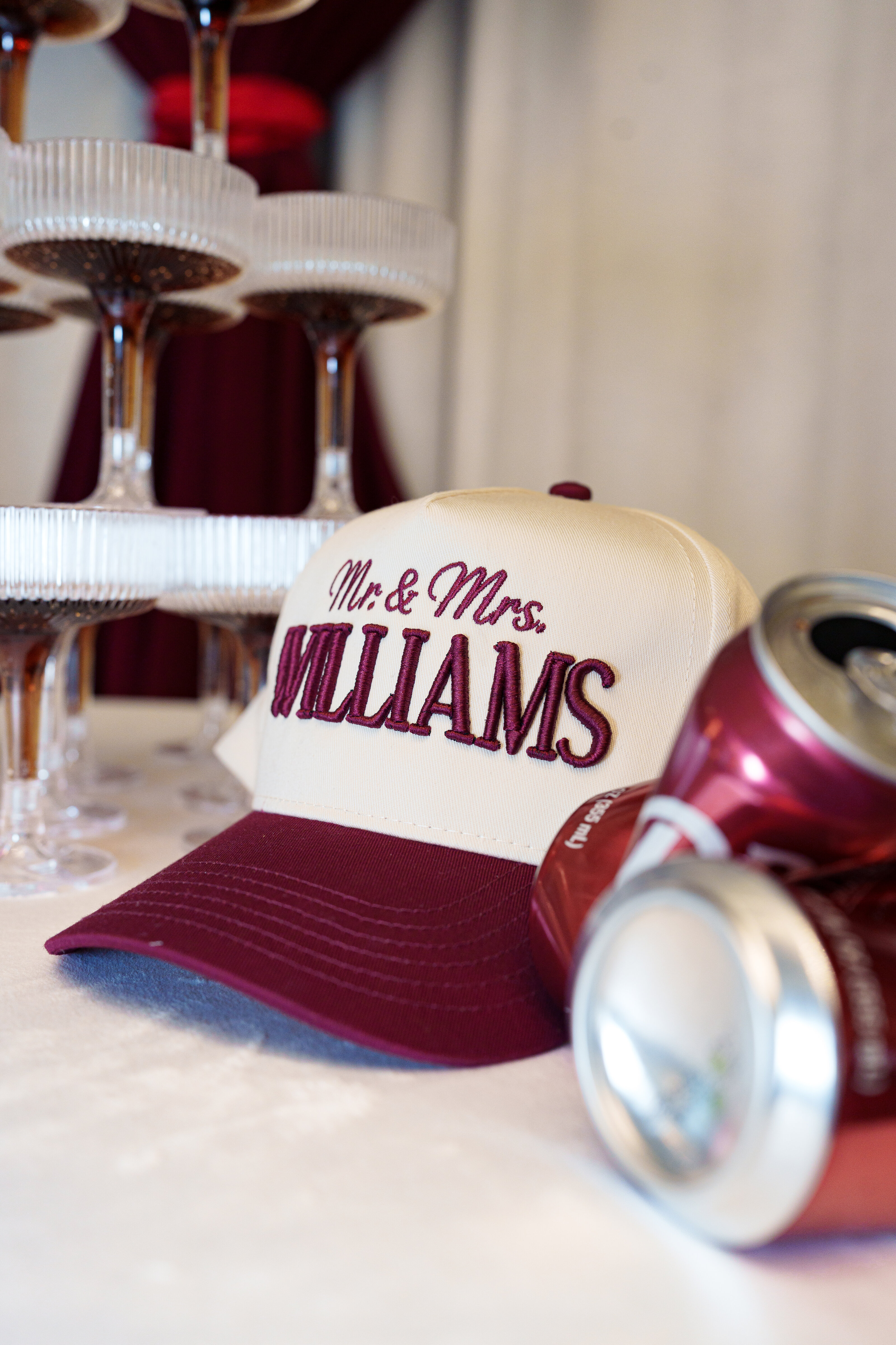 Bride and groom wearing custom embroidered hats at a Houston Texas wedding