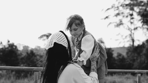 mother and daughter kissing