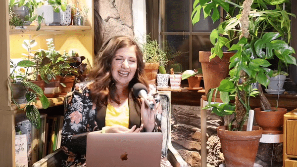 Video of Maria, Bloom & Grow Radio podcast, laughing and interviewing a podcast guest surrounded by plants