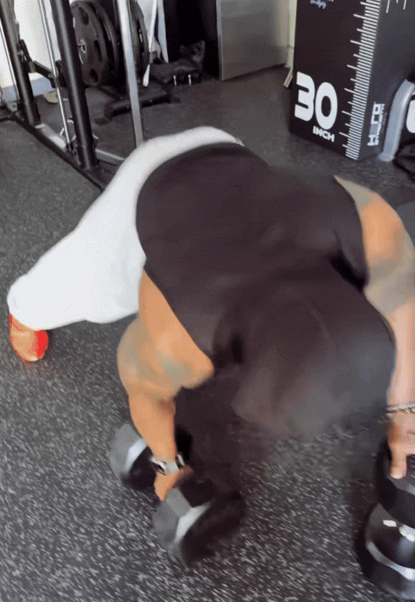 video of man doing weighted pushups