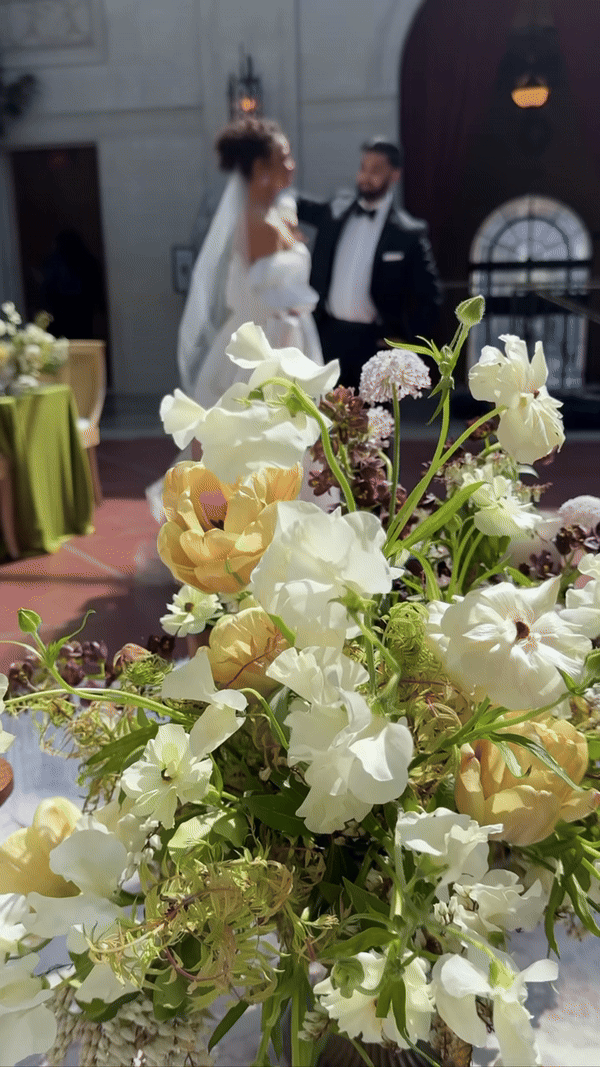 A happy wedding couple walks down the aisle in Columbus, Ohio, surrounded by guests celebrating their special day.