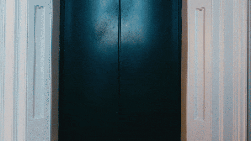 UK non-traditional wedding videographer captures a couple sharing a kiss inside a lift as the doors open. An epic moment of their non-traditional wedding film! 