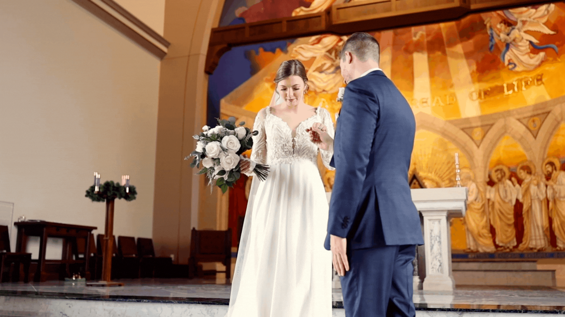 a couple kissing at their wedding ceremony