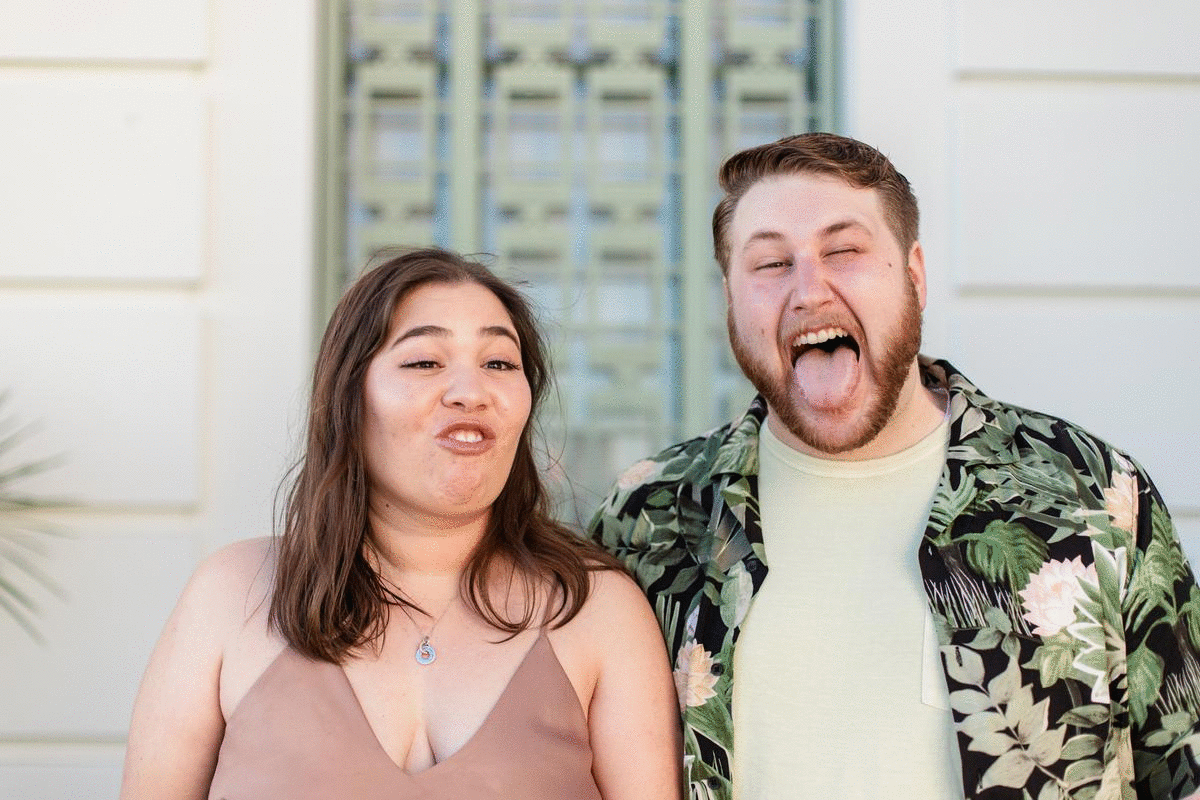 Edinburgh Bride and groom making funny faces at each other and laughing