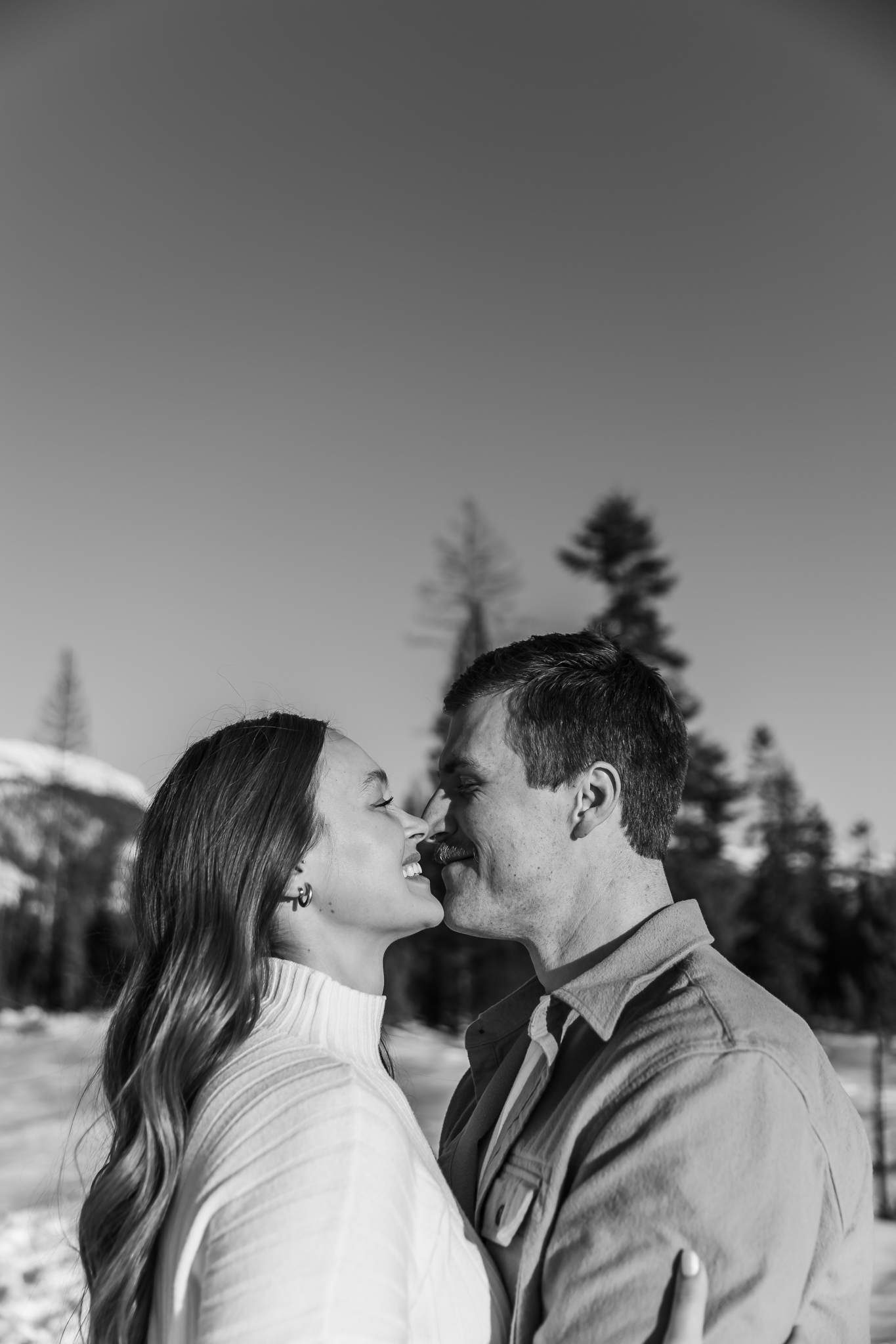 couple hugging during sunset wedding photos in glacier national park