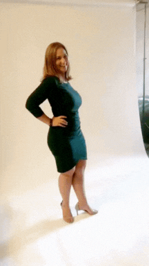 Keri doing photo shoot in green dress