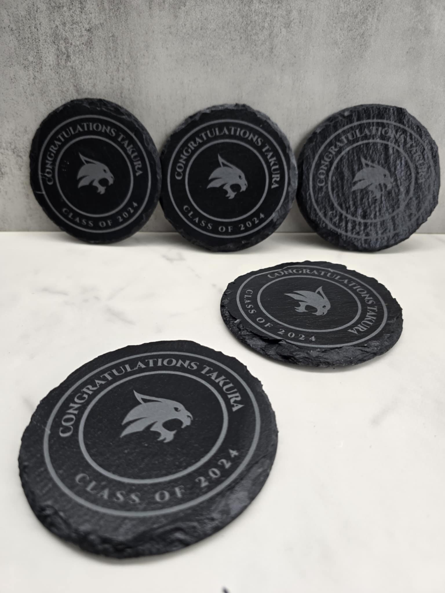 Custom laser engraving on metal at Hat Stitch in Katy TX